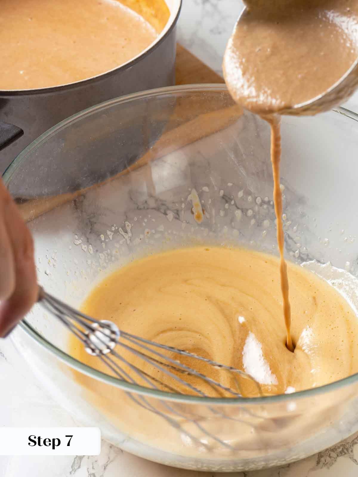Peach ice cream process with hot cream mixture being added.