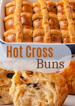 A pan of homemade hot cross buns with a shiny, glazed top.