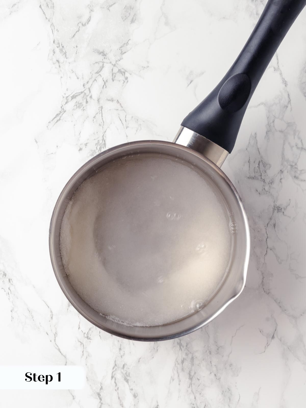 Milk heating in a pot, preparing for the dough mixture.