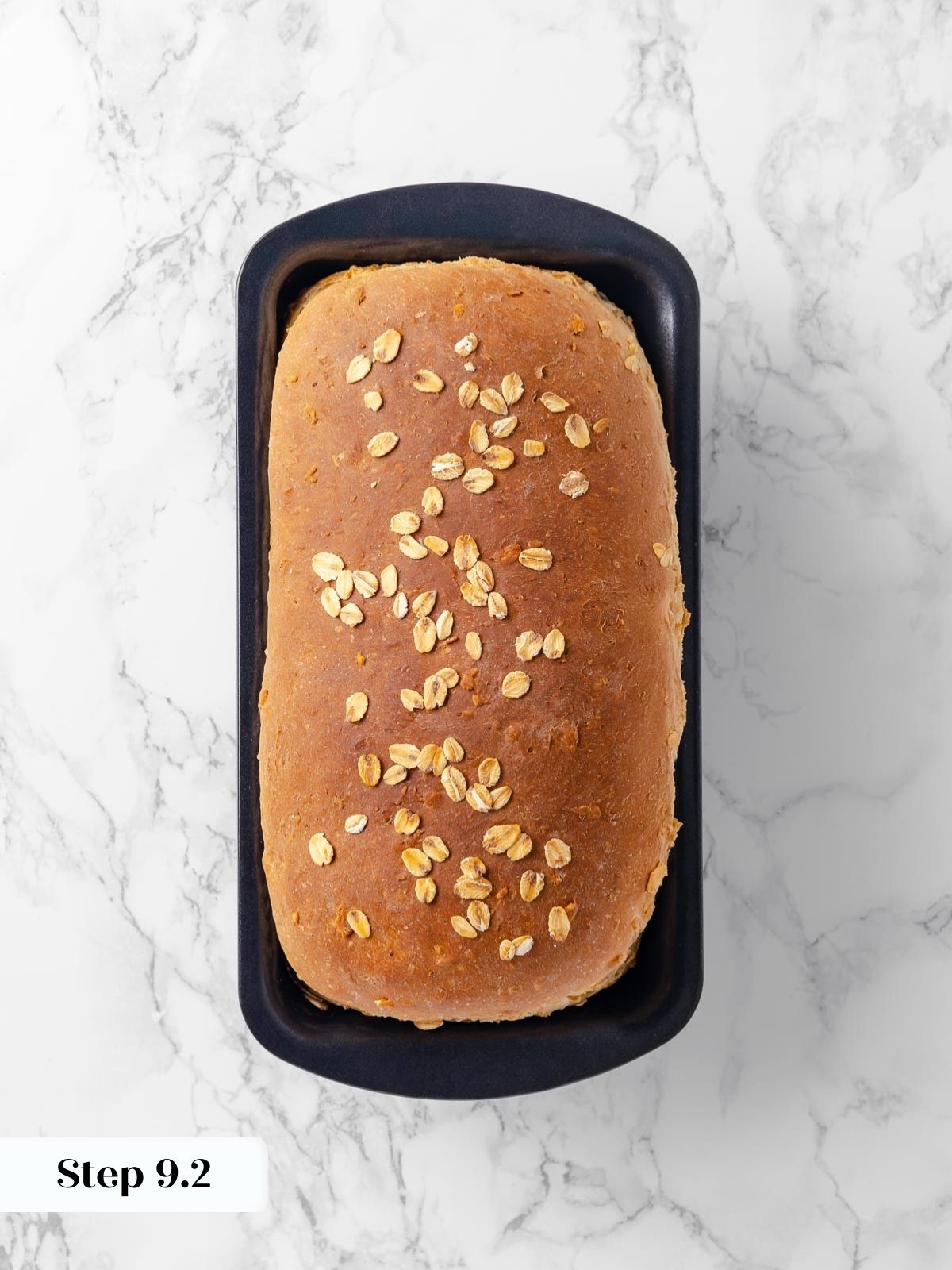 Baked oatmeal bread still cooling in the pan.