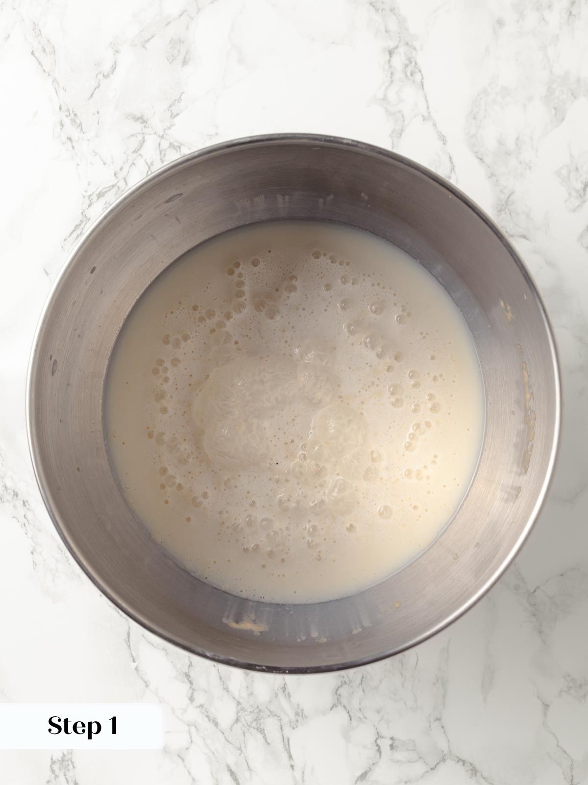 Mixing the yeast and water for homemade oatmeal bread.