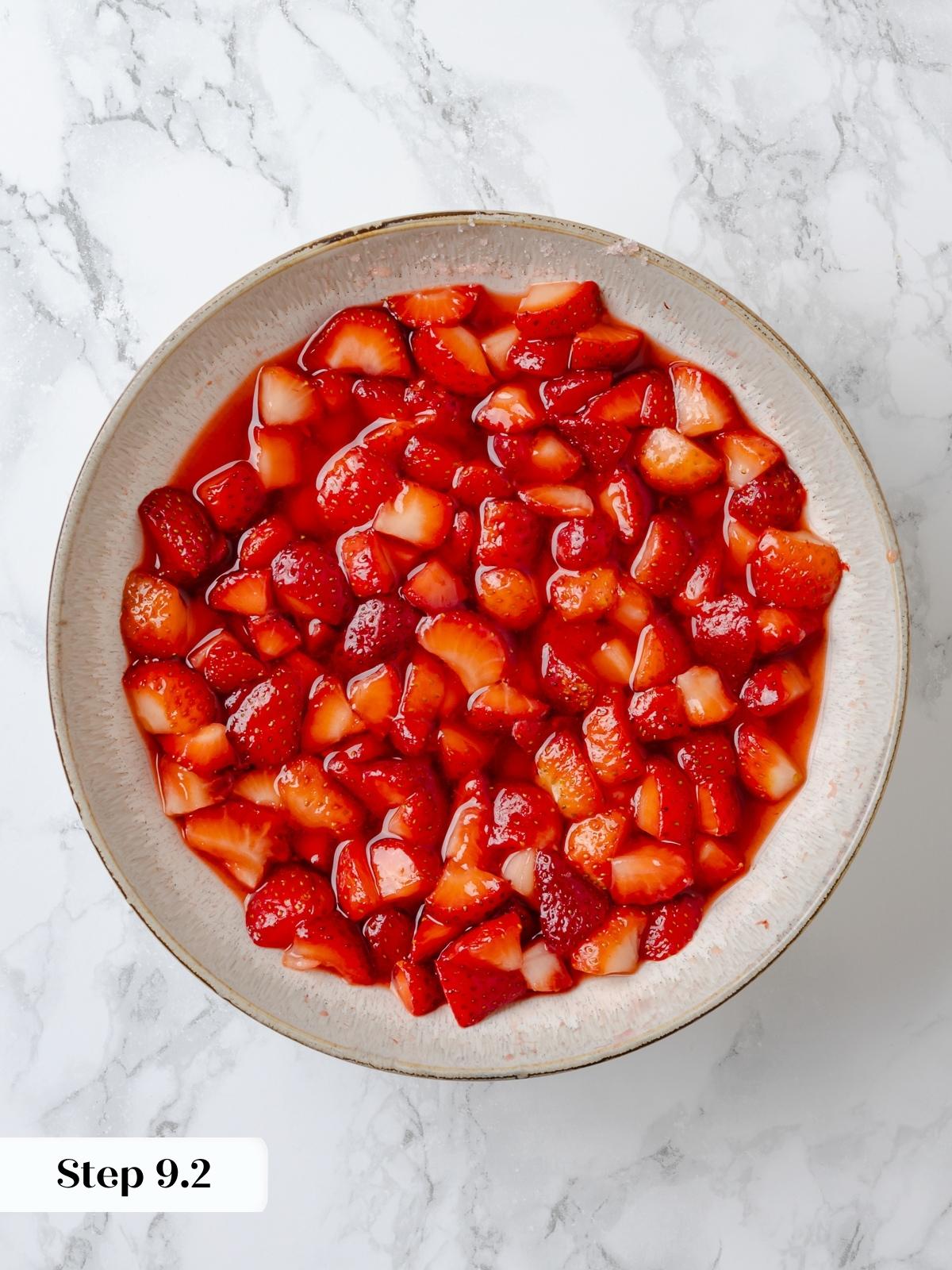 Softened strawberries after macerating, with visible juices.