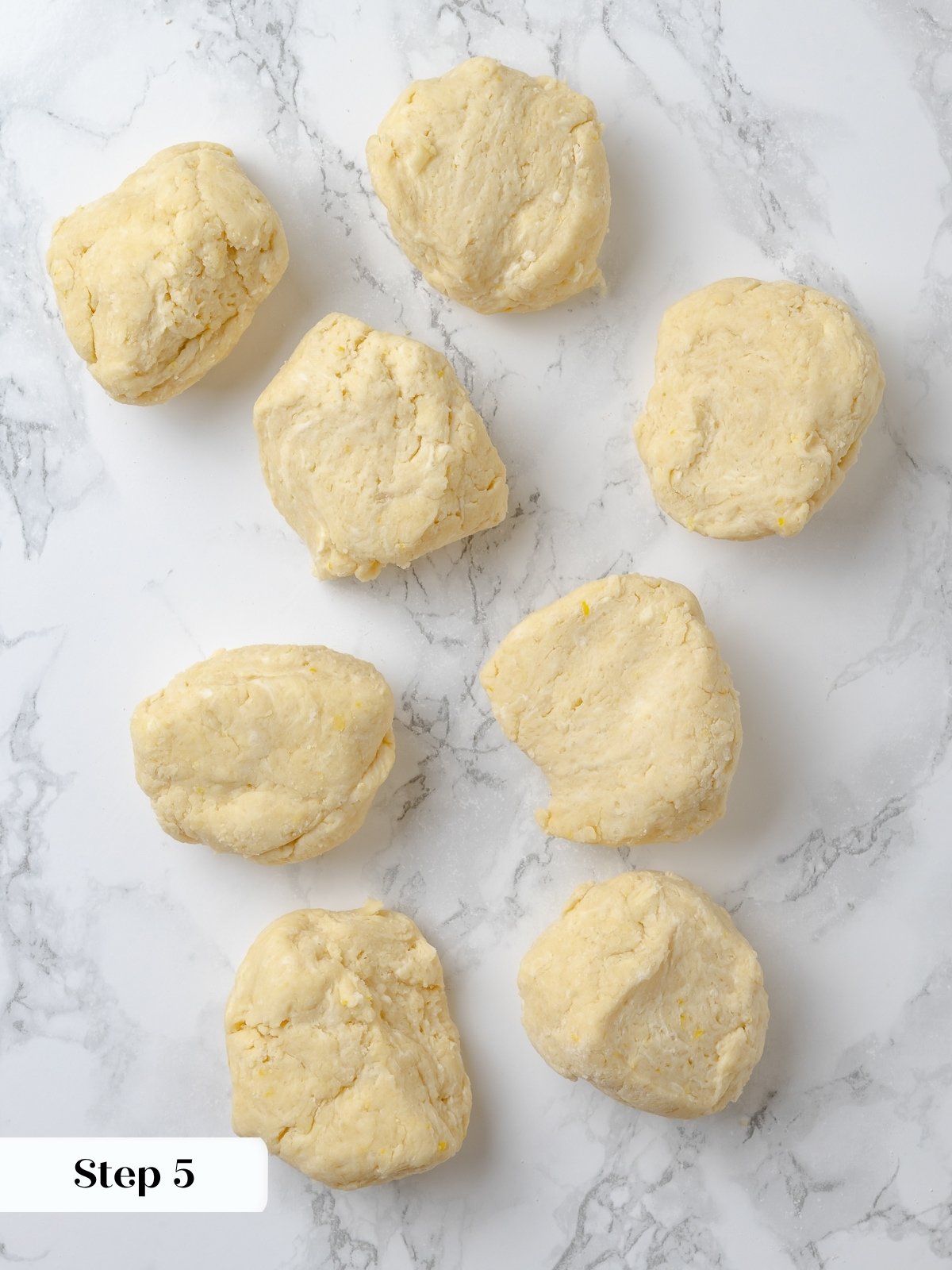 Portioning shortcake dough into rustic circles before baking.