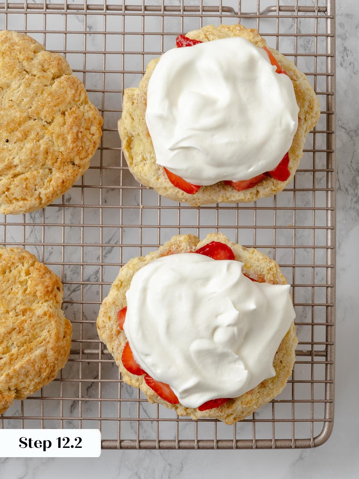 Fluffy whipped cream layered on strawberry-filled shortcakes.