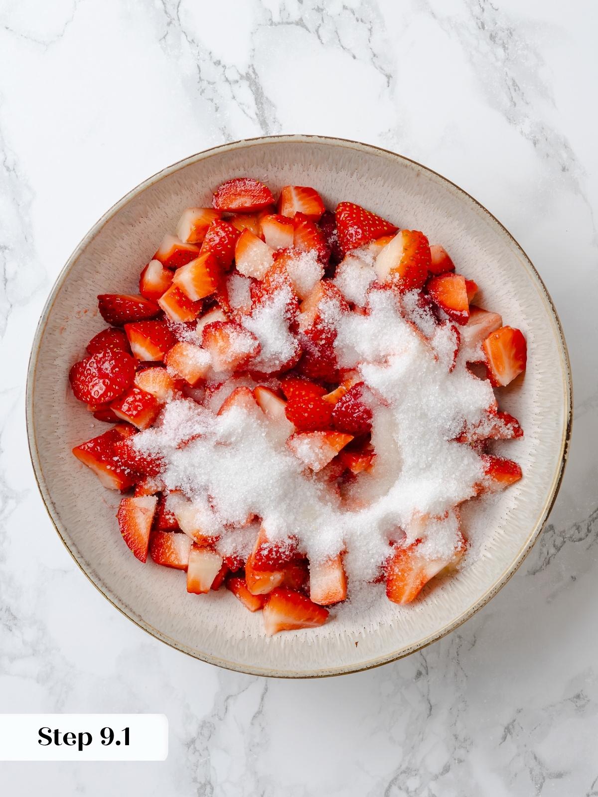 Fresh sliced strawberries mixed with granulated sugar.