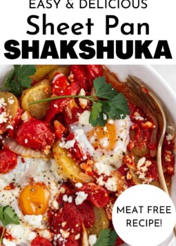 A white bowl filled with shakshuka and herbs.