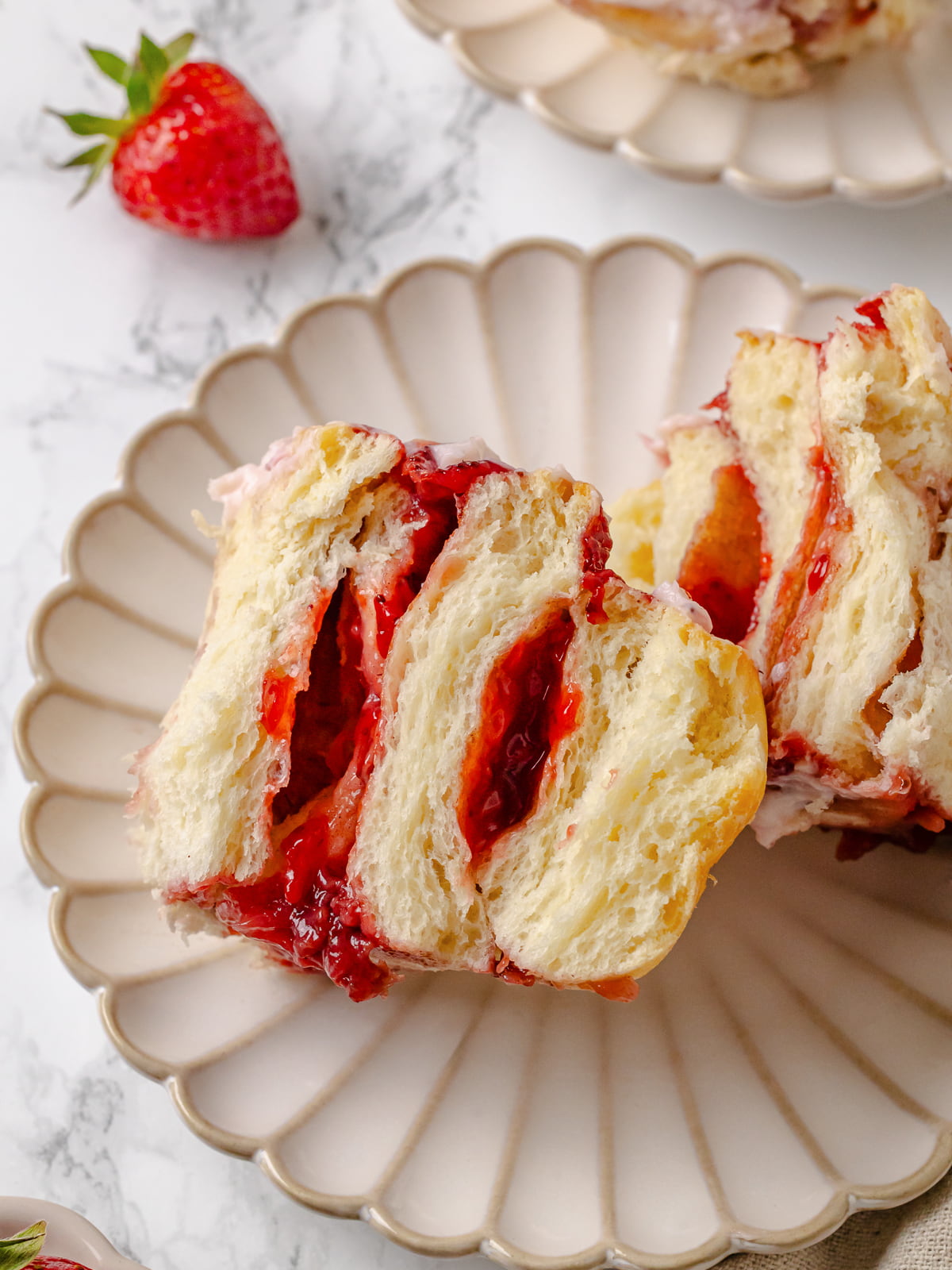 Cinnamon roll sliced to show jammy center.