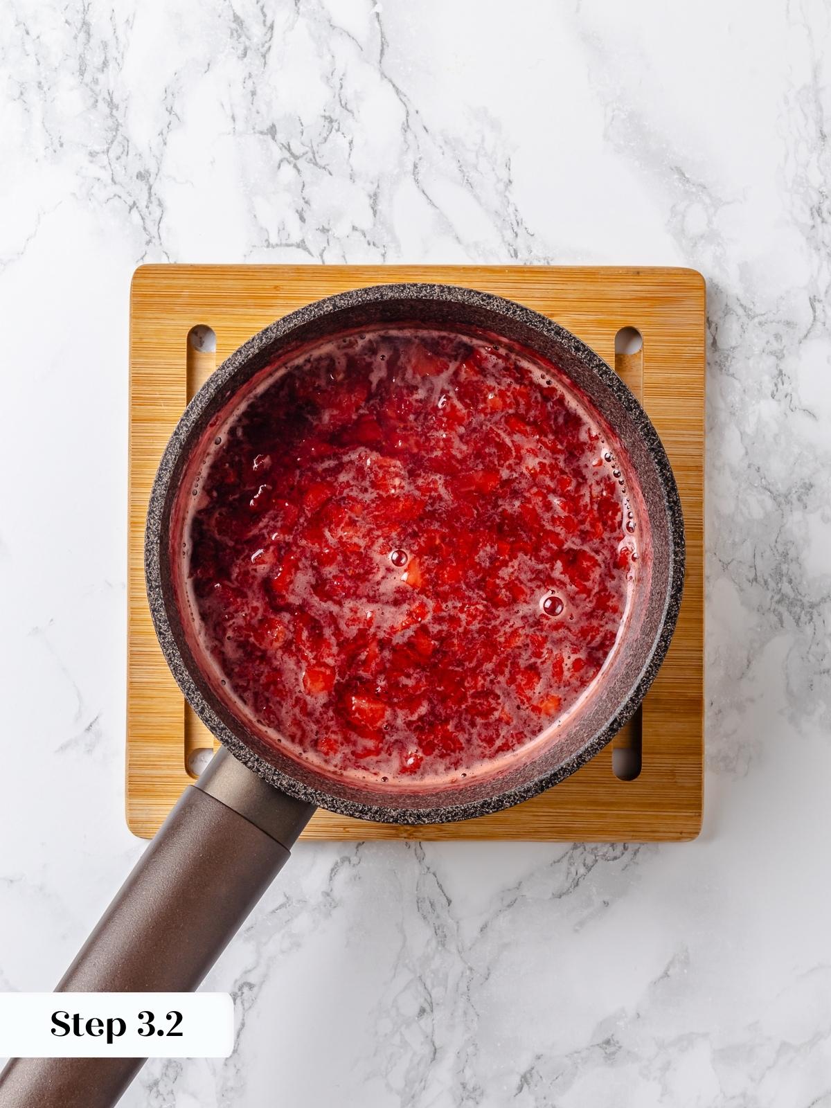 Fresh strawberries simmering to make filling.