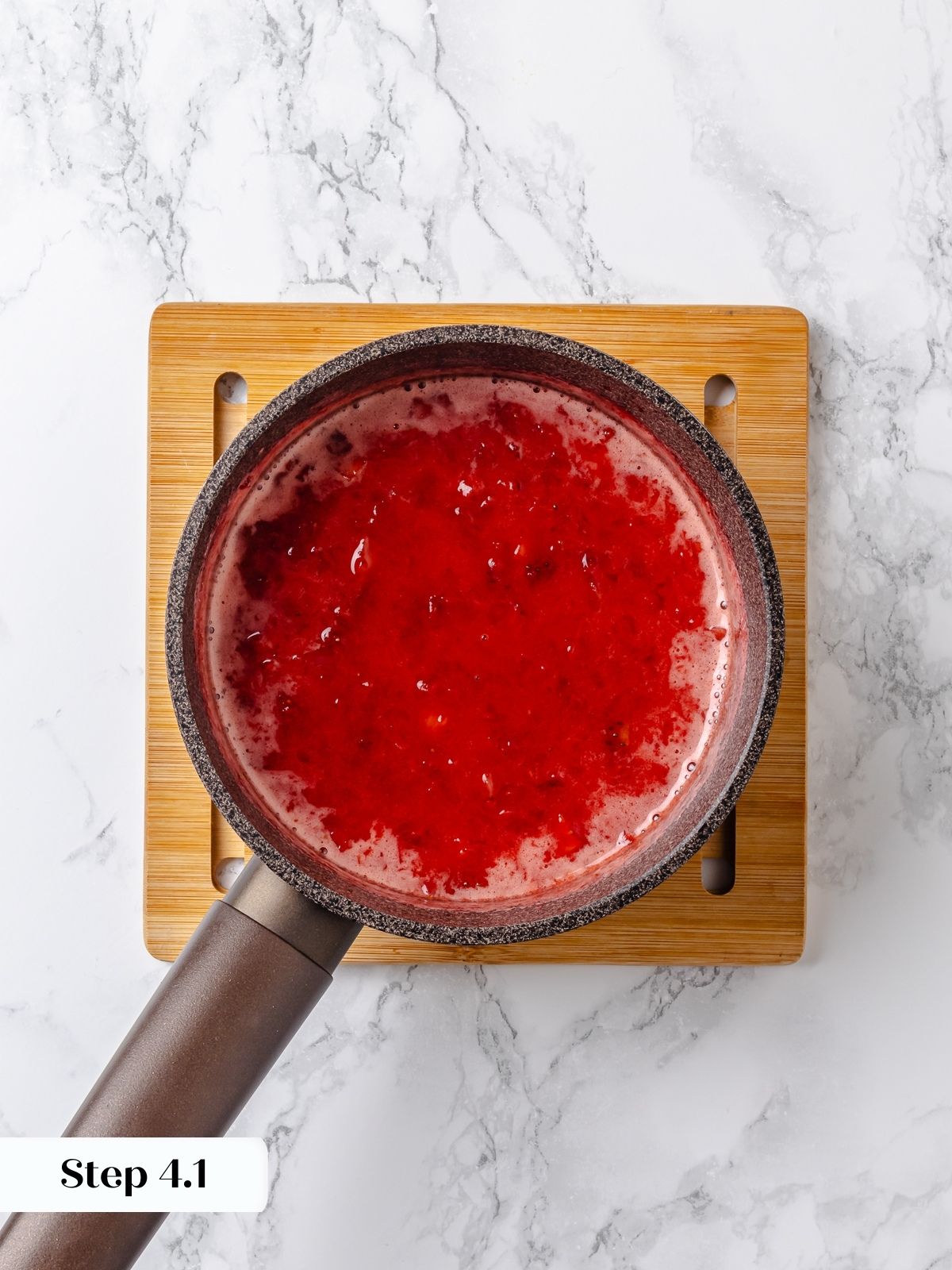 Thickening the jam with cornstarch.