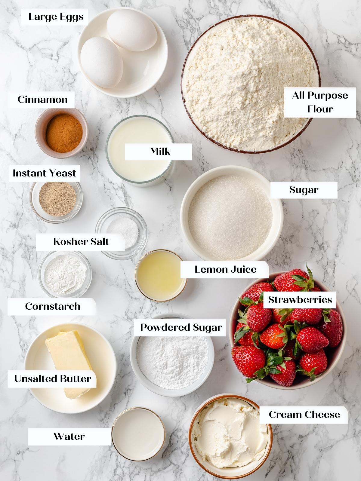 Measured cinnamon roll ingredients laid out on counter.