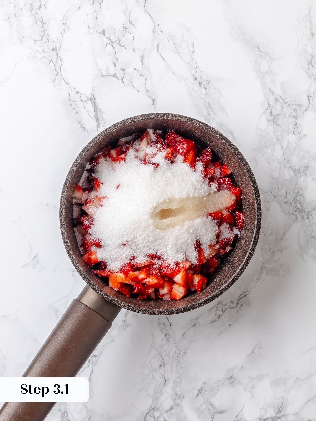 Fresh strawberries mixed with sugar for jam.