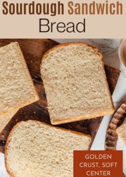 Freshly baked sourdough sandwich bread on a cutting board, sliced thick for family meals and sandwiches.