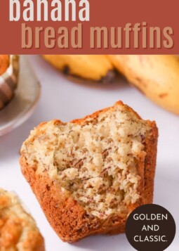 Banana bread muffin on a plate, fluffy and golden with soft, moist texture inside.
