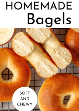 Fresh homemade bagels resting on a cooling rack after simmering and baking to golden perfection.