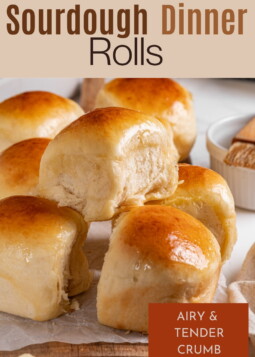 Fresh sourdough discard rolls sitting closely together showing their light, fluffy texture after baking.