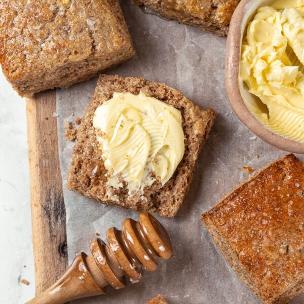 Warm whole wheat biscuit split open and spread with softened butter.