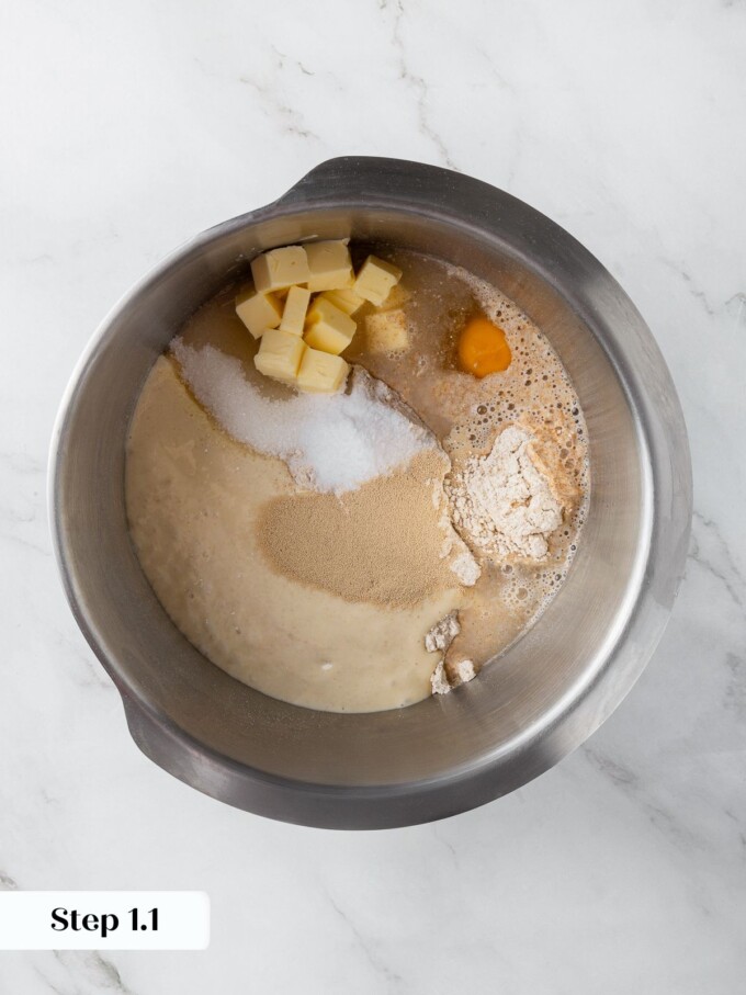 All ingredients for whole wheat sourdough rolls placed together in mixing bowl before combining.