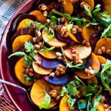 A colorful winter beet and persimmon salad bursting with all the flavors of the season; citrus in the dressing, smoky paprika, and spicy maple candied peanuts for texture and crunch. Vegan and gluten-free!
