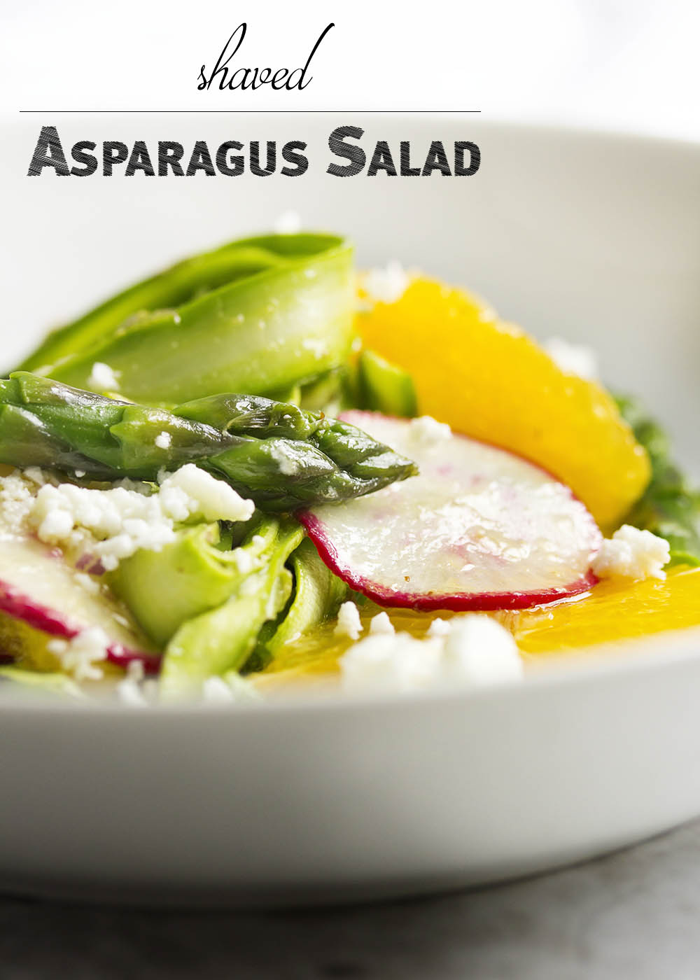 Shaved Asparagus and Orange Salad - Looking for something a little different to do with asparagus? Bored with your usual salad routine? Shaved asparagus salad is great and fun way to use asparagus with sweet oranges and spicy radishes all tossed with an orange vinaigrette. | justalittlebitofbacon.com