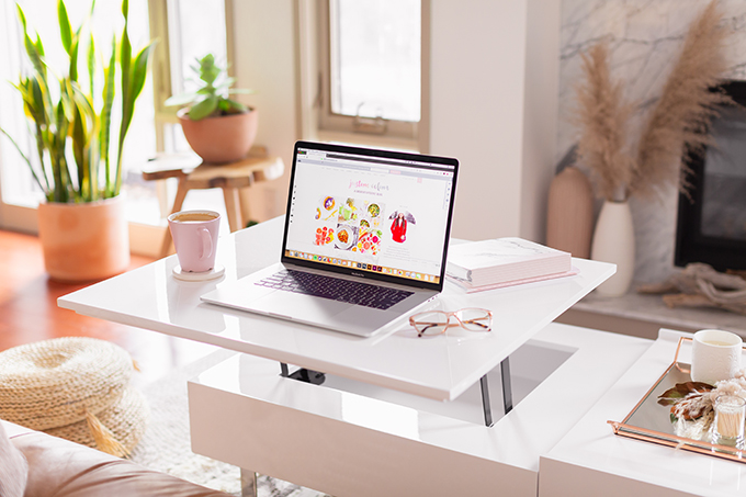 2018 Review + 2019 Goals | Calgary Lifestyle Blogger | 2019 Planning and Goal Setting | Entrepreneur Working from Home in an Mid Century Modern Apartment | MacBook Pro Laptop | Nespresso Coffee on a White Coffee Table | Structure EVO Coffee Table in White | Bonlook Lauren Blue Light Blocking Glasses In Peach // JustineCelina.com