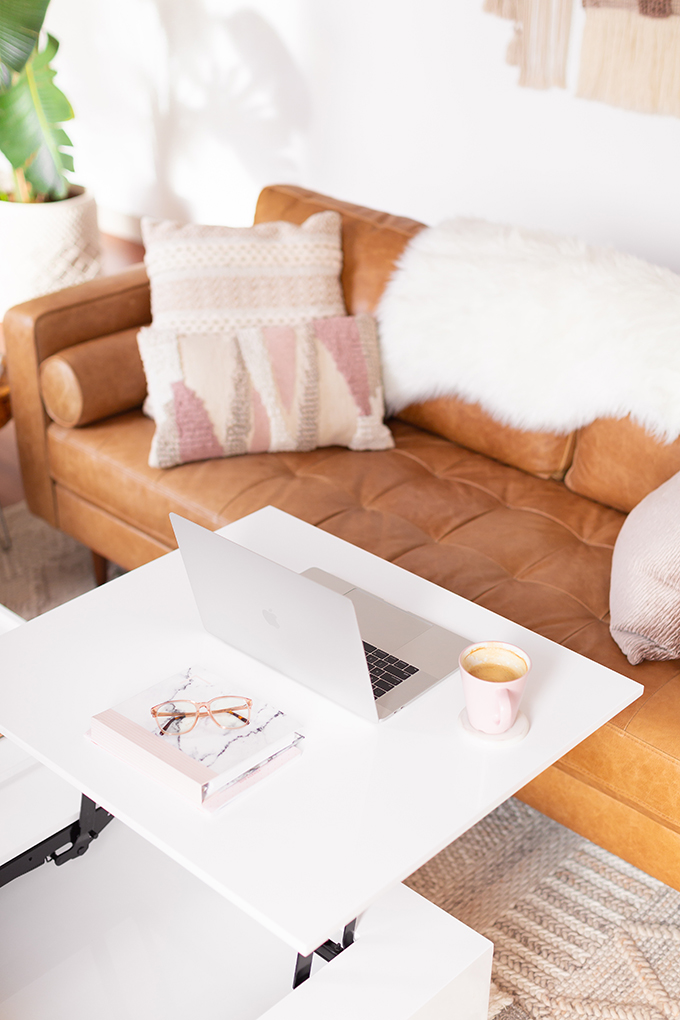 2018 Review + 2019 Goals | Calgary Lifestyle Blogger | 2019 Planning and Goal Setting | Entrepreneur Working from Home in an Mid Century Modern Apartment | MacBook Pro Laptop | Nespresso Coffee on a White Coffee Table | Structure EVO Coffee Table in White | Bonlook Lauren Blue Light Blocking Glasses In Peach // JustineCelina.com