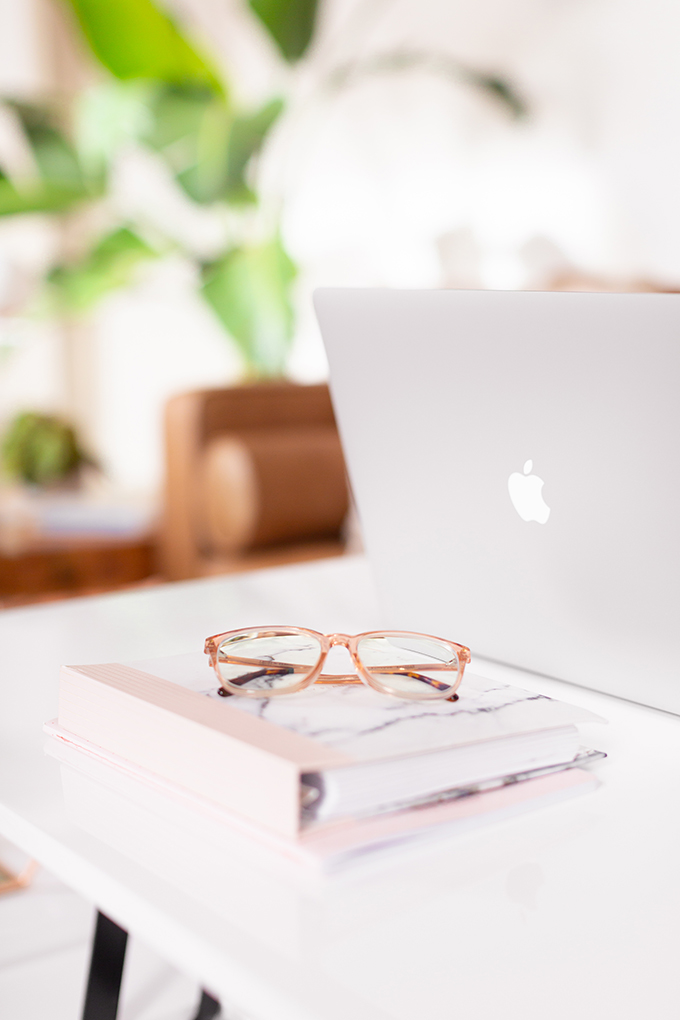 2018 Review + 2019 Goals | Calgary Lifestyle Blogger | 2019 Planning and Goal Setting | Entrepreneur Working from Home in an Mid Century Modern Apartment | MacBook Pro Laptop | Nespresso Coffee on a White Coffee Table | Structure EVO Coffee Table in White | Bonlook Lauren Blue Light Blocking Glasses In Peach // JustineCelina.com