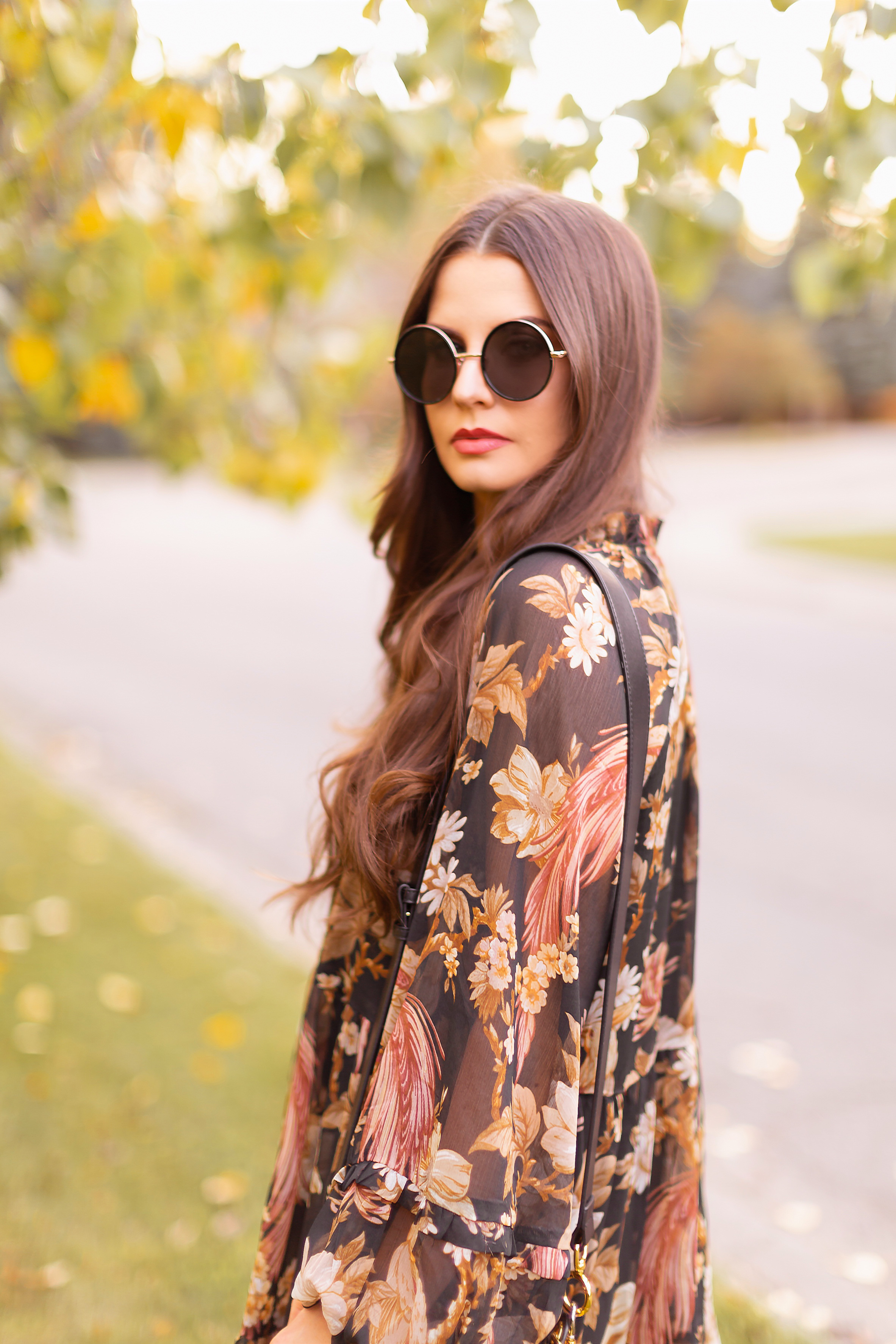 Summer to Fall 2019 Transitional Lookbook : Moody Florals | Top Summer to Fall 2019 Transitional Trends | Top Autumn 2019 Trends and How to Wear Them | The Best Moody Floral Dresses for Fall | | Brunette woman wearing an H&M Wide Cut Chiffon Floral Dress, Zara Taupe Mid-Calf Suede Boots, A Black Chloe Tess Dupe by Artisan Anything, Round Black Sunglasses and a Dark Red Lip | Top Calgary Fashion & Creative Lifestyle Blogger // JustineCelina.com