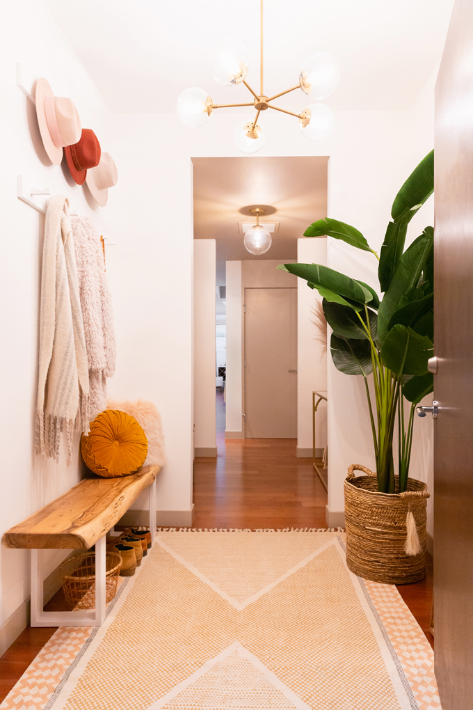 Space Refresh: Entrance Way Reveal in Partnership with Mobilia Canada | A Bohemian, Mid-Century Modern Apartment Entrance Way | Justine Celina Maguireβs Home | 2019 Home Decor Trends | Behr Ultra Pure White | Mobilia Aly Velji Modern India Collection Review | Bohemian, Mid Century Modern Decor | Faux Bird of Paradise Plant | Calgary Lifestyle, Interior Design and Home Decor Blogger // JustineCelina.com