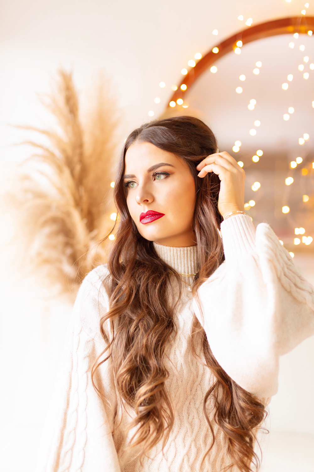 My Top 5 Red Lipsticks for the Holidays | LancΓ΄me Matte Shaker High Pigment Liquid Lipstick in Kiss Me ChΓ©rie photos, review, swatches | Brunette woman wearing a red lipstick and cable kit sweater dress in a festive holiday setting with bokeh lights | Best universal red lipstick | Best luxury red lipstick | Best red liquid lipstick | Best long lasting red lipstick | Best red lipstick 2021 | Christmas lipstick 2021 | Mask friendly red lipstick | Calgary Beauty Blogger // JustineCelina.com