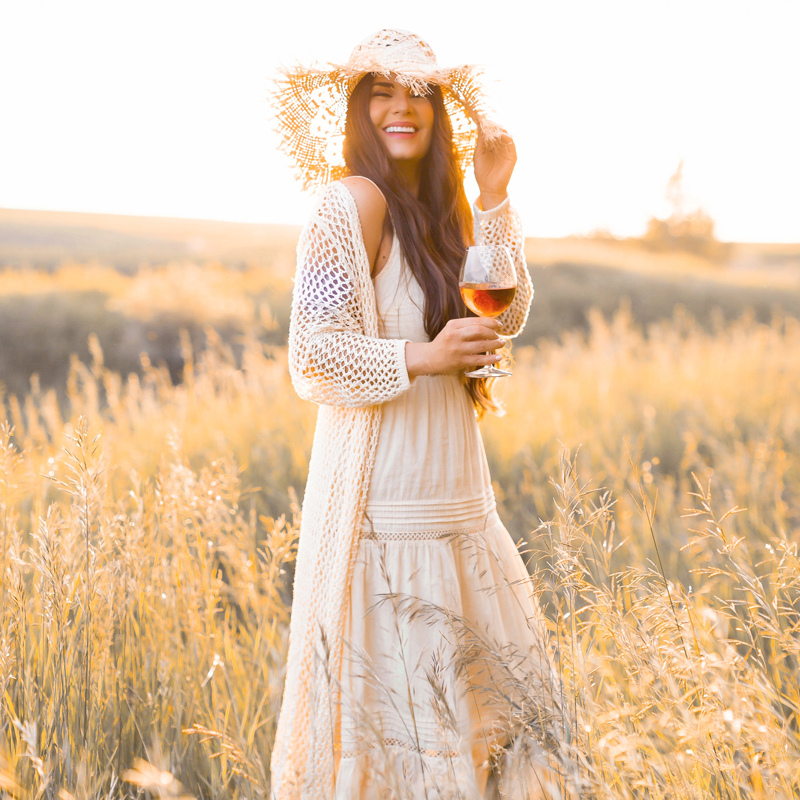 June 2020 Soundtrack | Chill Summer Playlist | Inspiring Summer Playlist Spotify | Laughing brunette woman enjoying a glass of rosΓ© wine in a sunlit prairie wheat field at sunset | JustineCelinaβs childhood home in Wheatland County, Alberta | Summer 2020 Bohemian Style Ideas | Boho Casual Summer Dresses | Summer 2020 Fashion | Best H&M Dresses Summer 2020 | How to Style a Frayed Brim Straw Hat | Calgary, Alberta, Canada Creative Lifestyle Blogger and Entrepreneur// JustineCelina.com