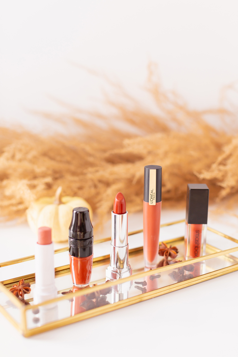 My Top 5 Pumpkin Spice Lipsticks | JustineCelinaβs favourite fall lipsticks | Beauty Bloggerβs Favourite fall lipsticks | The Best Pumpkin Spice Lipsticks for Fall | Lipstick Trends | Physicians Formula Organic Wear Tinted Lip Treatment in Gingersnap Review, LancΓ΄me Matte Shaker High Pigment Liquid Lipstick in Abrick Adabra Review, L'Oreal Rouge Signature Liquid Lip Colour in I Amaze Review, Smashbox Always On Matte Liquid Lipstick in Out Loud Review | Calgary Beauty Blogger // JustineCelina.com