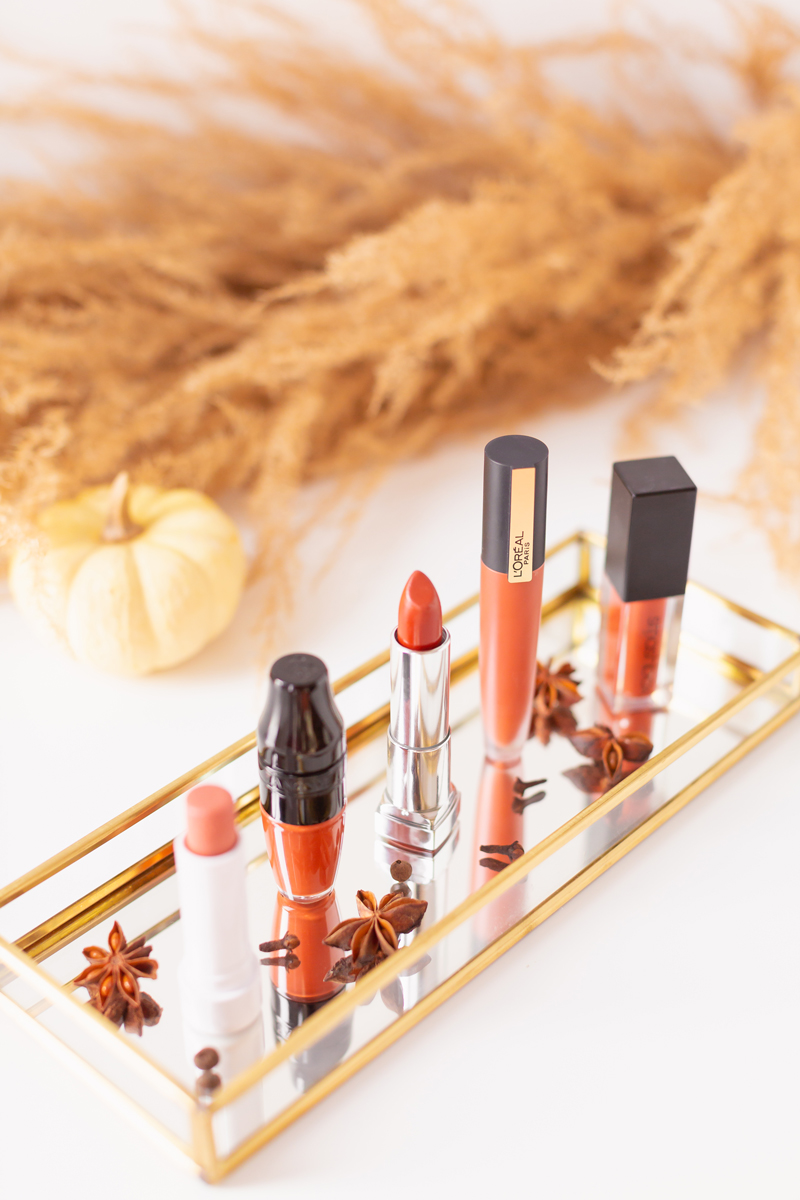 My Top 5 Pumpkin Spice Lipsticks | JustineCelinaβs favourite fall lipsticks | Beauty Bloggerβs Favourite fall lipsticks | The Best Pumpkin Spice Lipsticks for Fall | Lipstick Trends | Physicians Formula Organic Wear Tinted Lip Treatment in Gingersnap Review, LancΓ΄me Matte Shaker High Pigment Liquid Lipstick in Abrick Adabra Review, L'Oreal Rouge Signature Liquid Lip Colour in I Amaze Review, Smashbox Always On Matte Liquid Lipstick in Out Loud Review | Calgary Beauty Blogger // JustineCelina.com