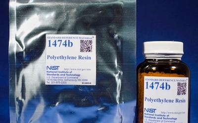 two packages of NIST SRM 1474b, one in a labeled foil packet and the other in a labeled brown glass bottle