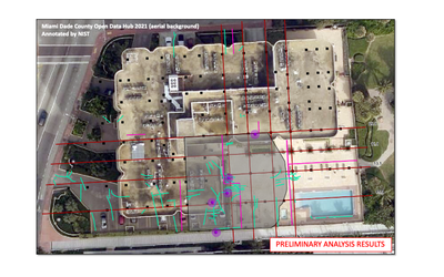 Aerial view of Champlain Towers South before the partial collapse is marked with a red grid and smaller green lines clustered on one side of the building. 