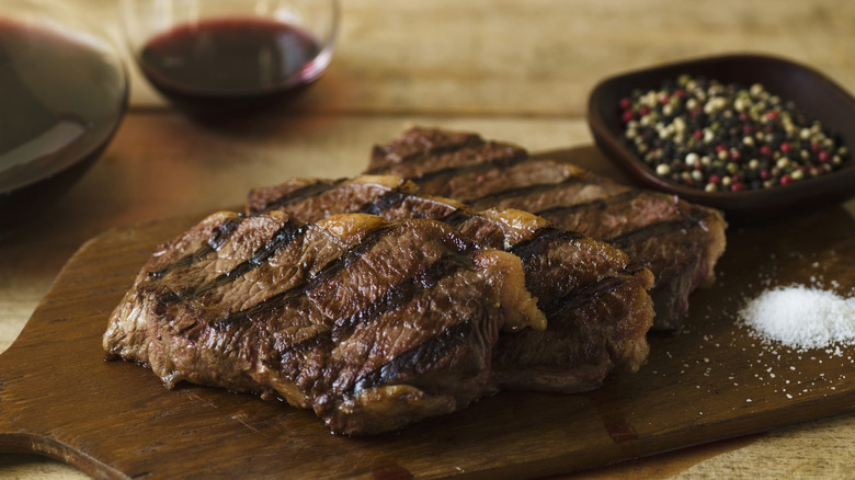 steak with dish of seasoning