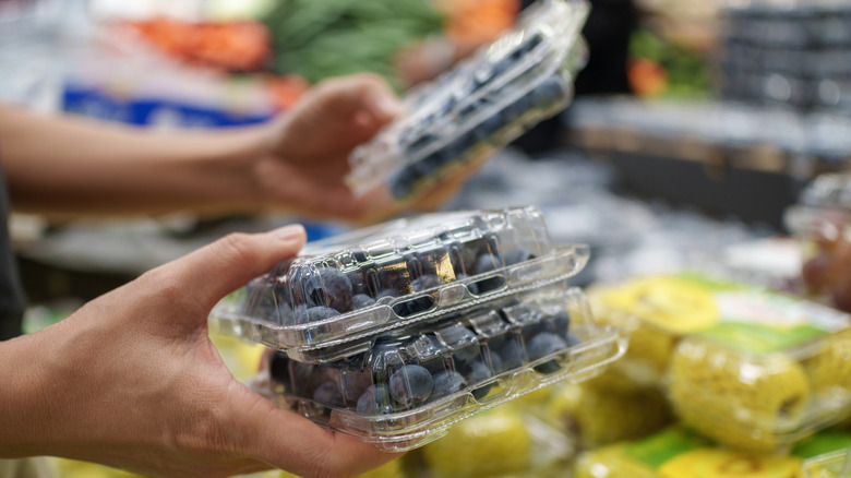 blueberries packed for sale in green cartons
