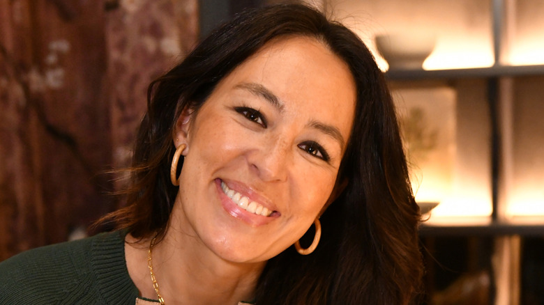 Joanna Gaines smiling with her cookbook