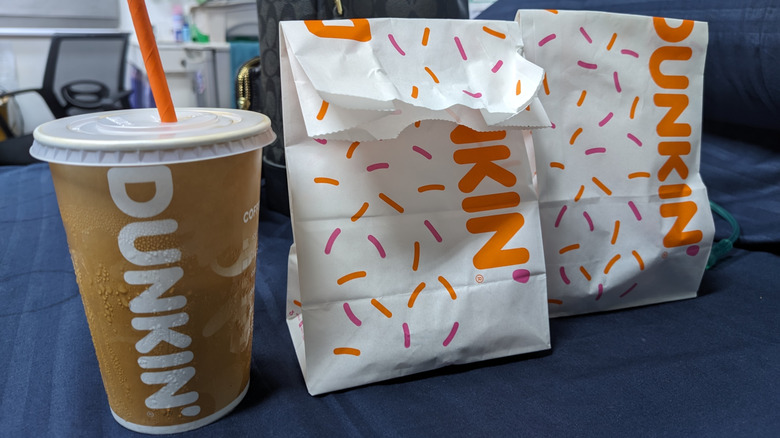 Dunkin' Donuts food bags with drink