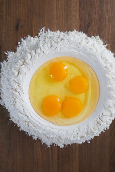 Eggs in a flour well for homemade pasta.