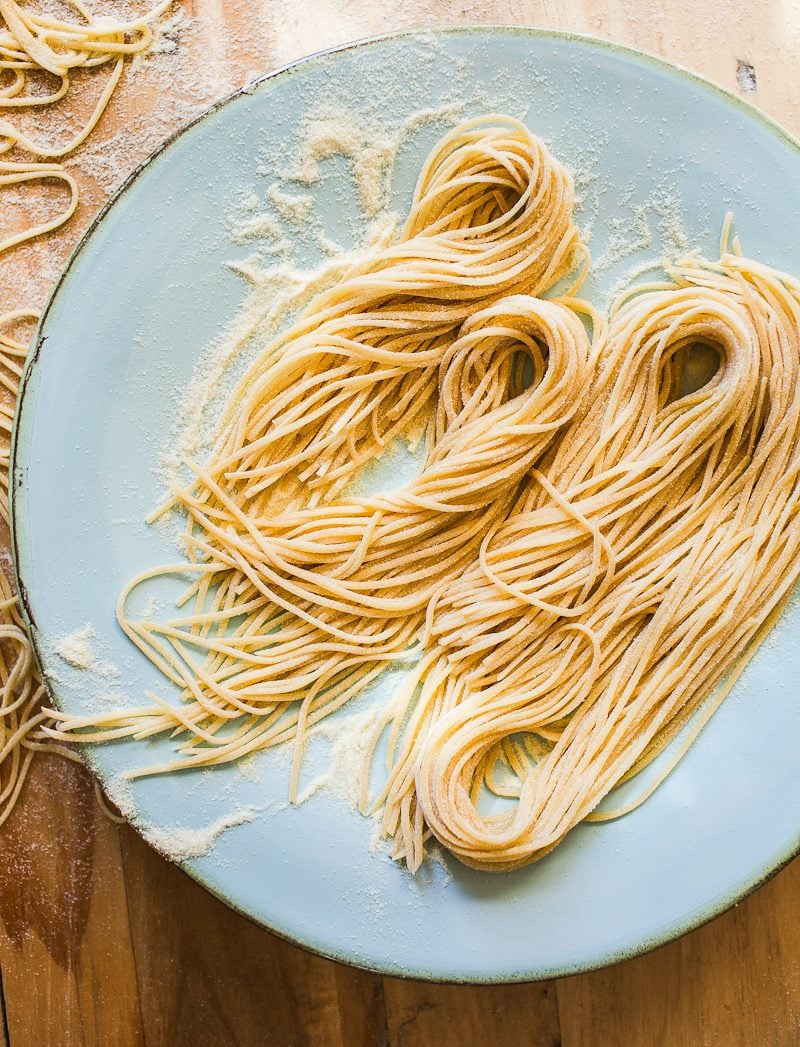 Homemade sourdough pasta on a blue plate