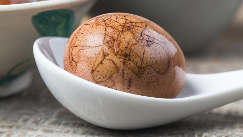 Chinese tea egg on a spoon
