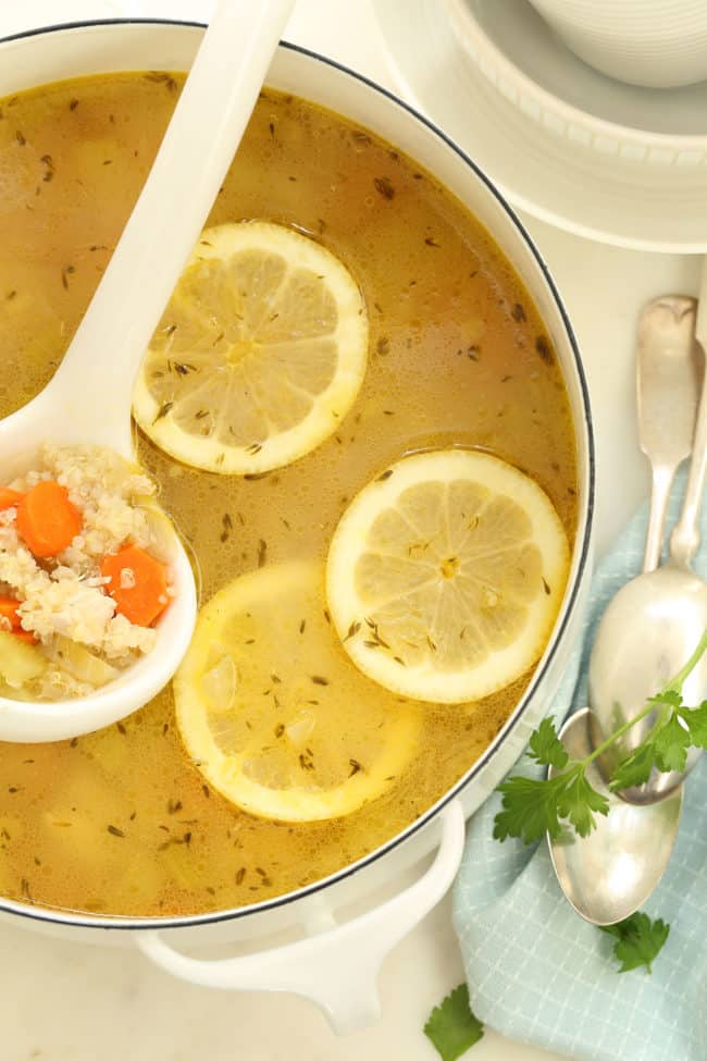 Lemon Chicken Quinoa Soup Lemon Chicken Quinoa Soup in a white pot with a white ladle.