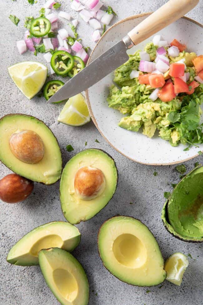 avocados are a fruit A bowl of mashed guacamole.