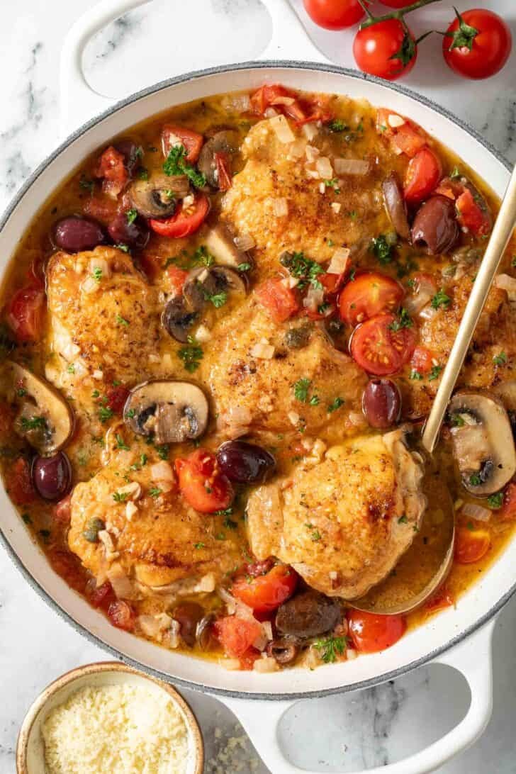 One Pan Italian Chicken One Pan Italian Chicken in a white Dutch oven.