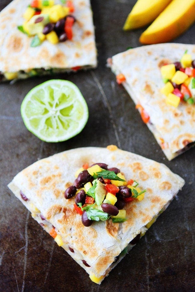 Mango Black Bean Quesadillas with avocado, red pepper, cilantro, onion, and jalapeño make a quick and easy meal that kids and adults love!