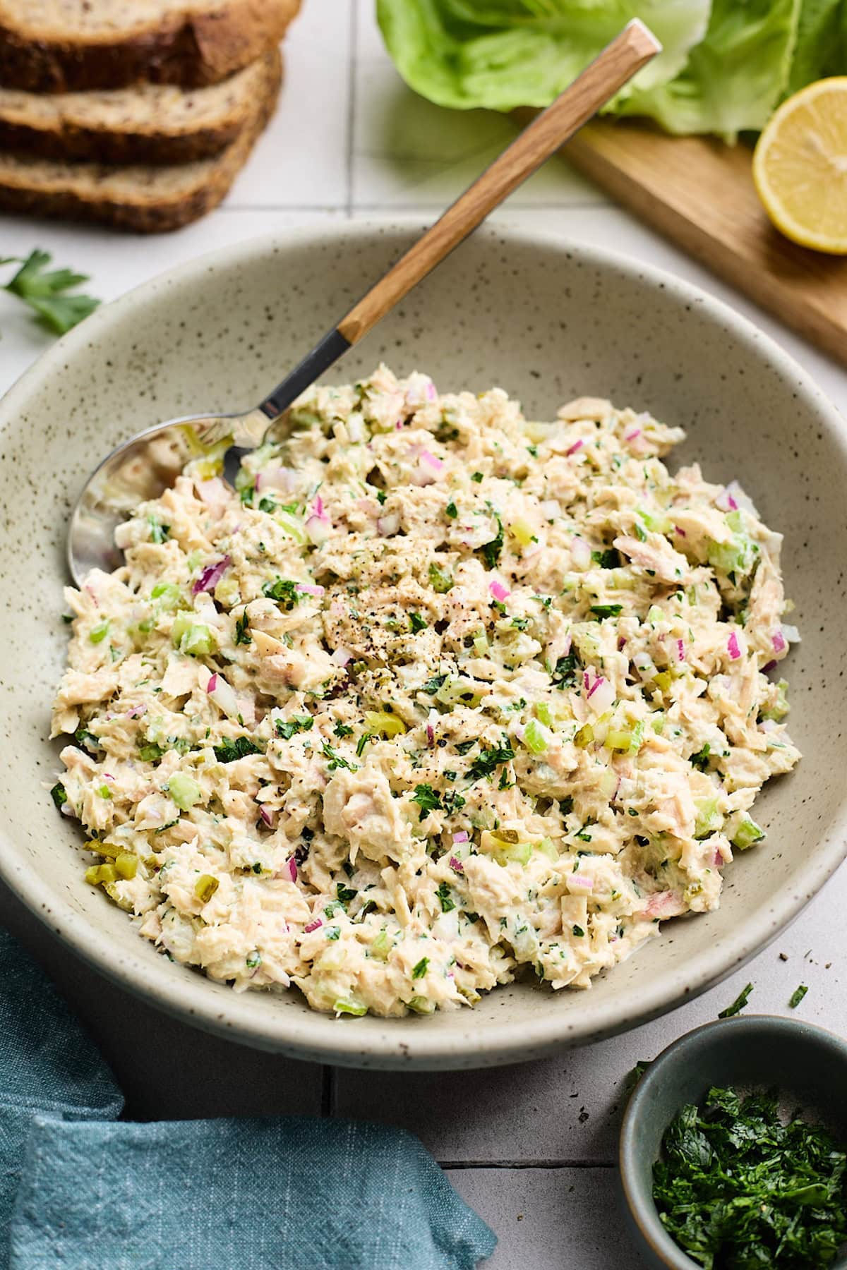 tuna salad in a bowl with a spoon.